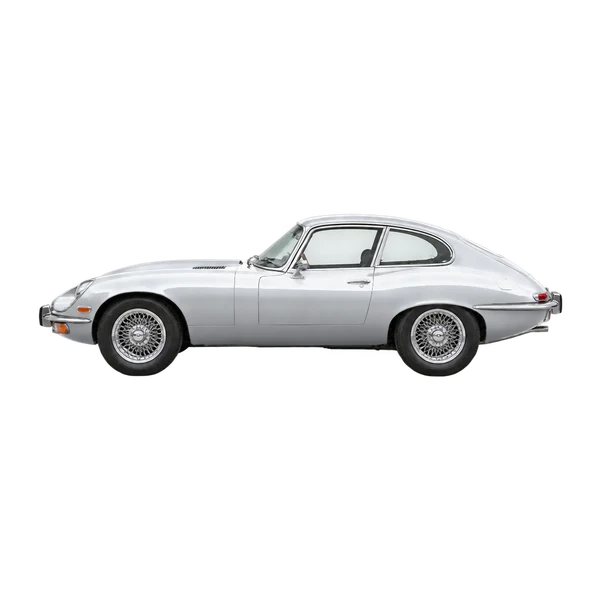 Jaguar E-Type 1990 باللون فضي، منظر جانبي (متجه إلى اليسار)