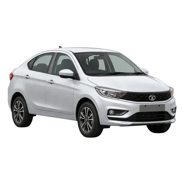 Tata Tigor 2025 باللون فضي، منظر منظر أمامي بزاوية ثلاثة أرباع (متجه لليسار)